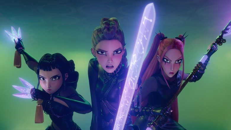 Rumi, Mira, and Zoey brandishing weapons fiercely in KPop Demon Hunters
