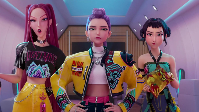 HUNTR/X standing on their personal jet in KPop Demon Hunters