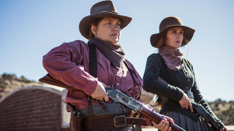 Merritt Weaver as Mary Agnes McNue and Michelle Dockery as Alice Fletcher brandish shotguns in Godless
