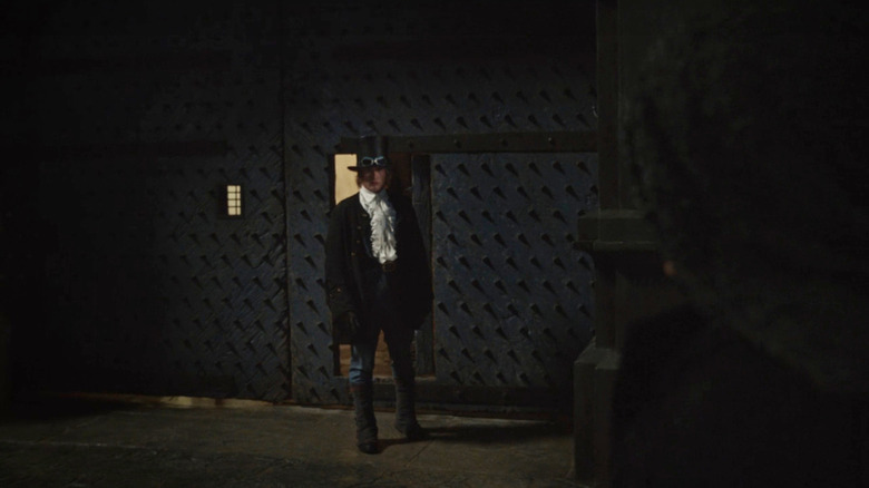 Sabo standing in the dark talking to Dragon in One Piece