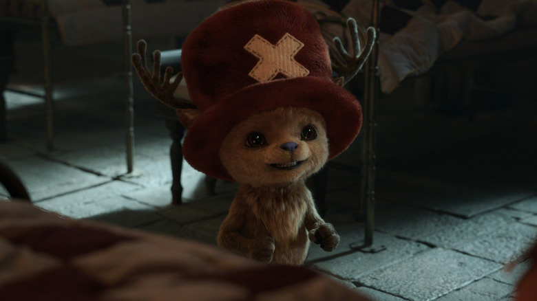 Chopper looking adorable and talking enthusiastically to a patient in One Piece