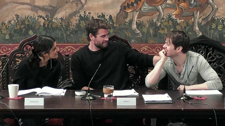Anya Chalotra, Liam Hemsworth, and Joey Batey at a table read for The Witcher season 4.
