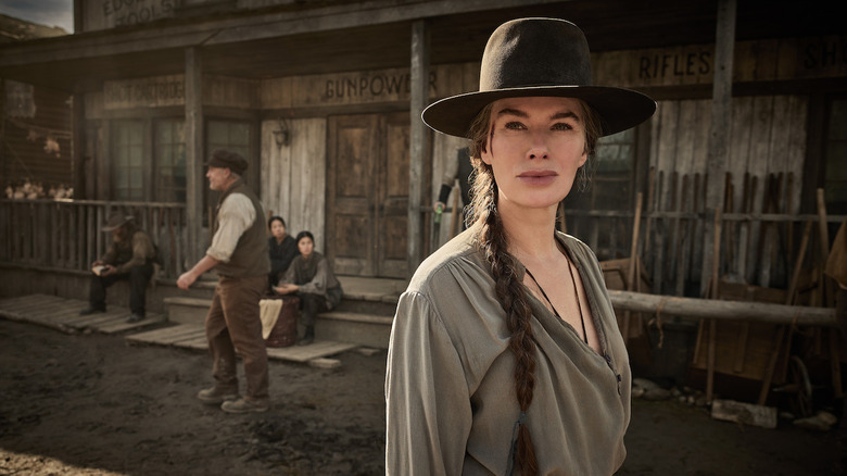 Lena Headey as Fiona Nolan standing in front of an Old West store in The Abandons
