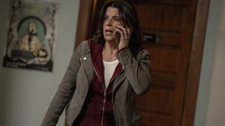 Sidney Prescott holding a phone to her ear in "Scream 7"