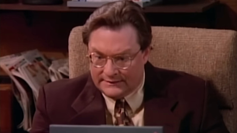 Jimmy (Stephen Root) staring at laptop in NewsRadio
