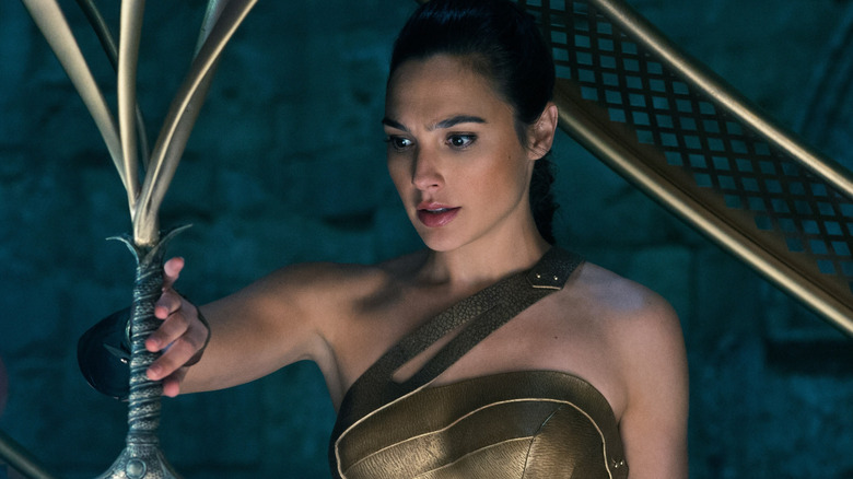 Gal Gadot grabbing sword as Wonder Woman