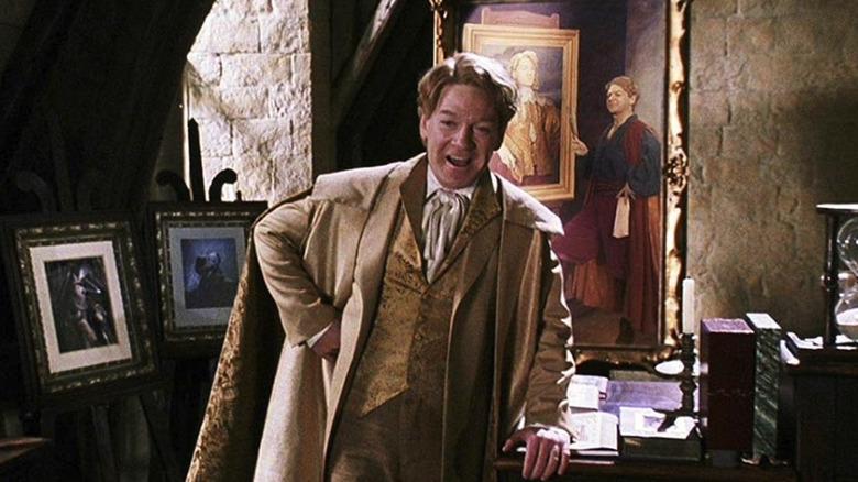 Gilderoy Lockhart standing in front of a painting of himself in Harry Potter and the Chamber of Secrets