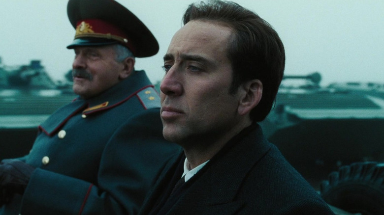 Yevgeni Lazarev as General Dimitri and Nicolas Cage as Yuri Orlov in a field of tanks in Lord of War