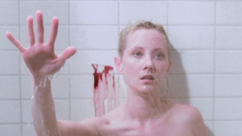 Anne Heche takes a blood-splatterd shower as Marion Crane in Psycho (1998)