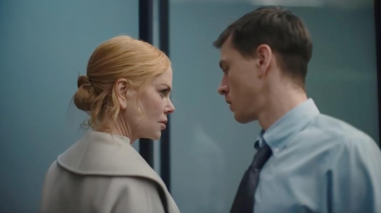 Romy and Samuel looking at each other in the office in Babygirl