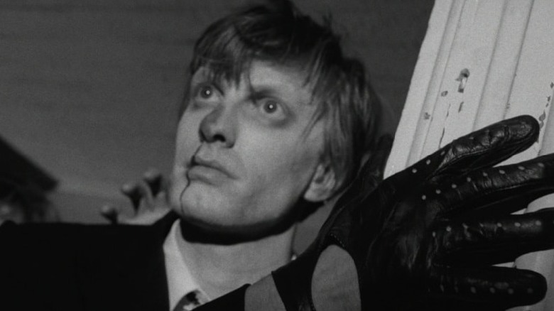 An injured person in Night of the Living Dead