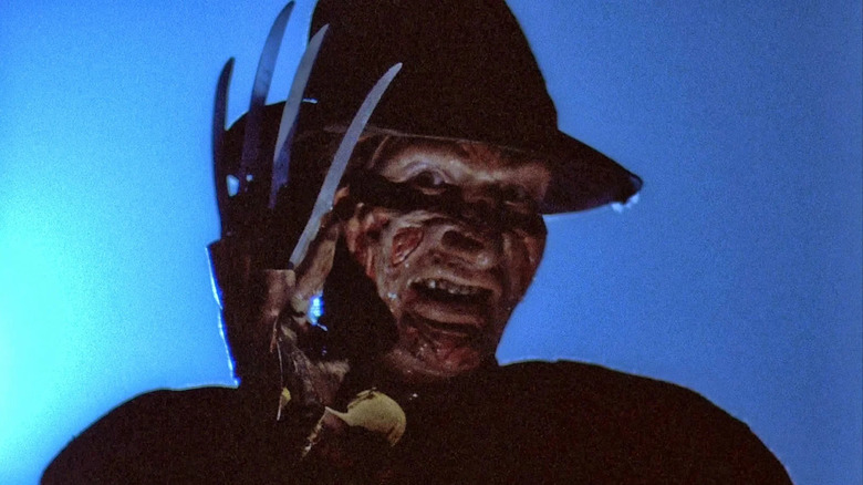 Freddy Krueger looks menacing, glove raised