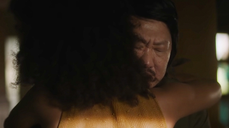 Benedict Wong and Zazie Beetz embrace in Nine Days