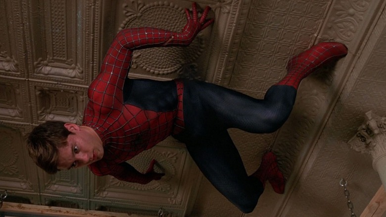 Tobey Maguire hanging from the ceiling in Spider-Man