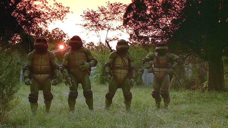 Michelan Sisti, Josh Pais, David Forman, and Leif Tilden as Michelangelo, Raphael, Leonardo, and Donatello in Teenage Mutant Ninja Turtles  