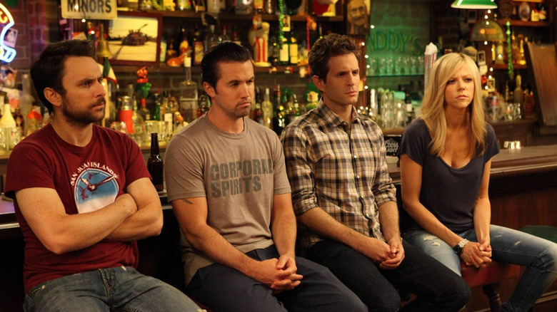 Charlie, Mac, Dennis, and Deandra in a bar on It's Always Sunny in Philadelphia.