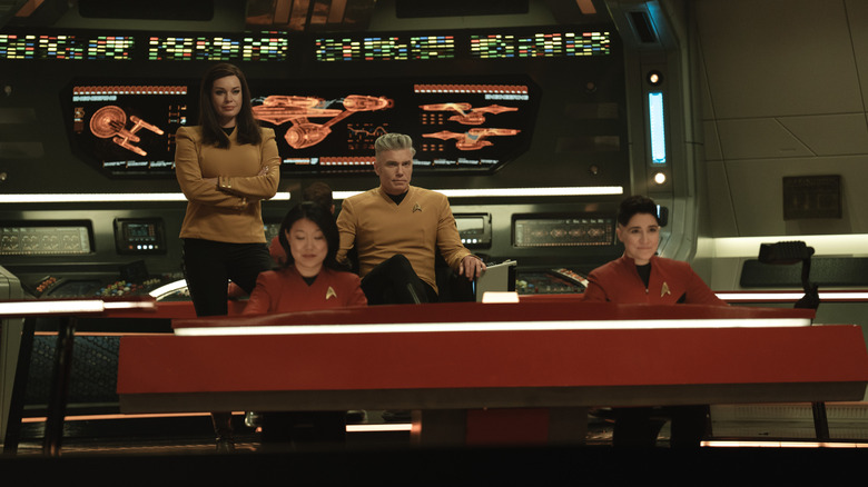 Rebecca Romijen in the role of Una, Jabal Anason as Pike captain, and Melisa Navia in Ortigas, run their stations on the USS SAS Star Trek bridge: strange new worlds