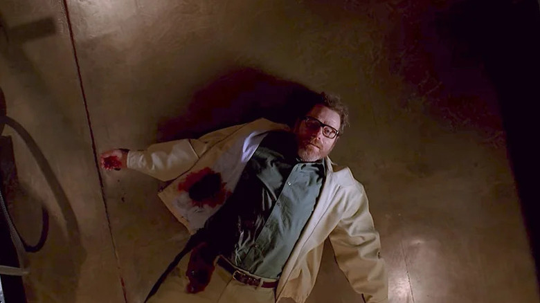 Bryan Cranston's Walter White lays on the floor with a bleeding wound in Breaking Bad
