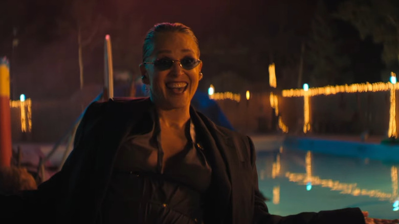 Lendina smiling with her arms out in Nobody 2