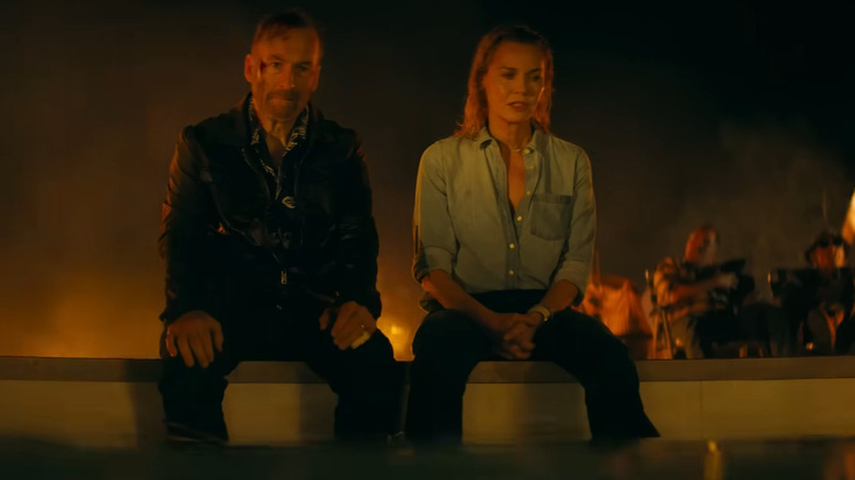 Hutch and Becca sitting atop a pool in Nobody 2