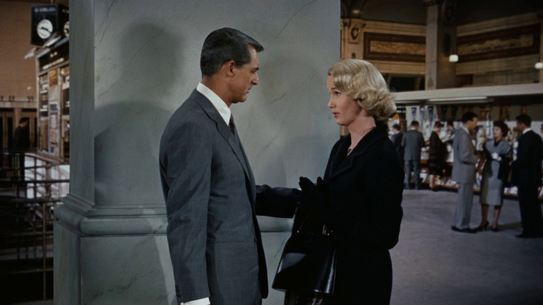Cary Grant as Roger O. Thornhill and Eva Marie Saint as Eve Kendall speaking in a train station