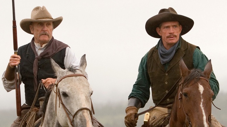 Robert Duvall as Prent Ritter and Thomas Haden Church as Tom Harte are astride horses in Broken Trail