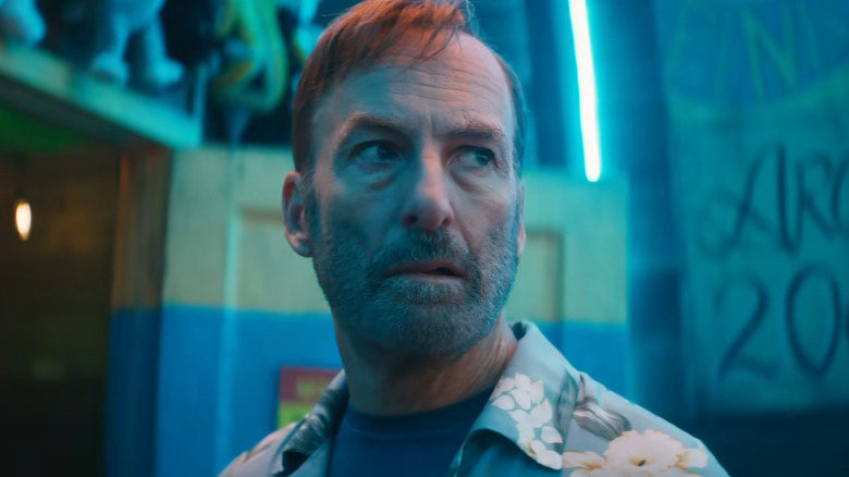 Hutch Mansell looking upset in an arcade in Nobody 2