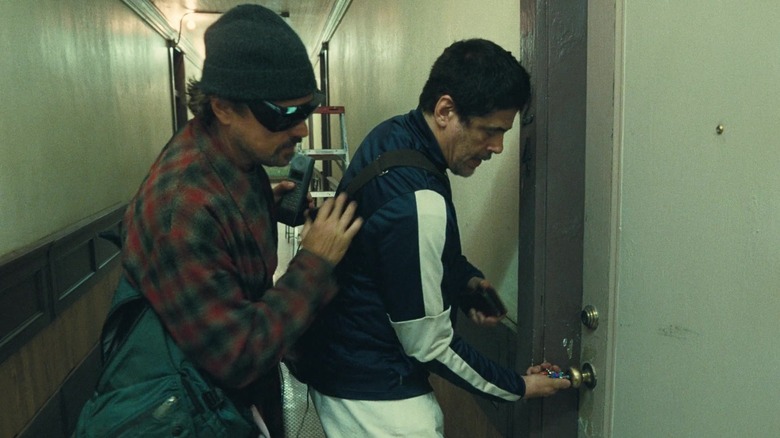 Bob and Sensei heading into Sensei's apartment in One Battle After Another