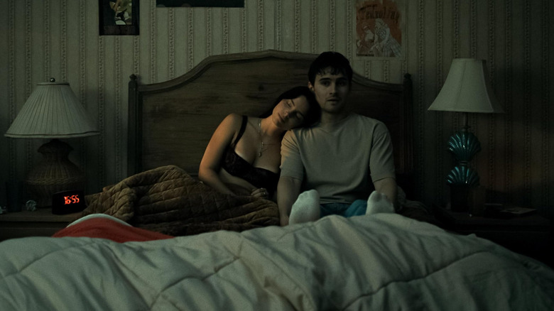 Nikki and Bear in bed in Obsession