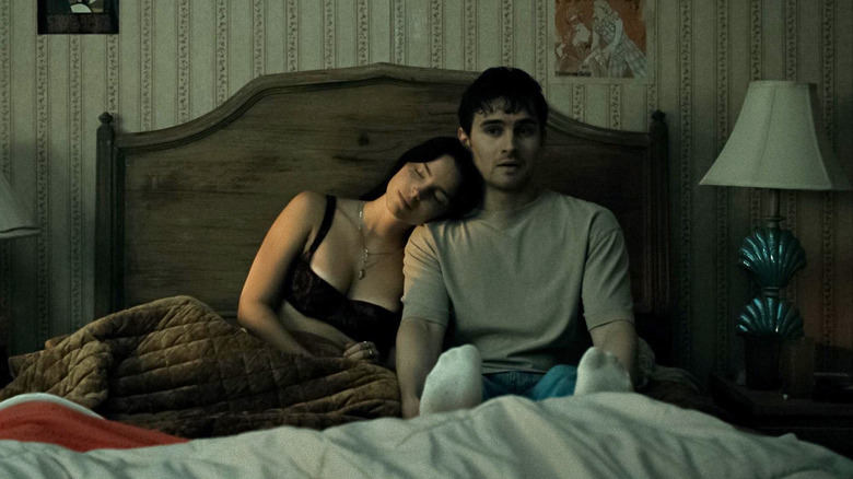 Nikki laying on Bear in his bed in Obsession
