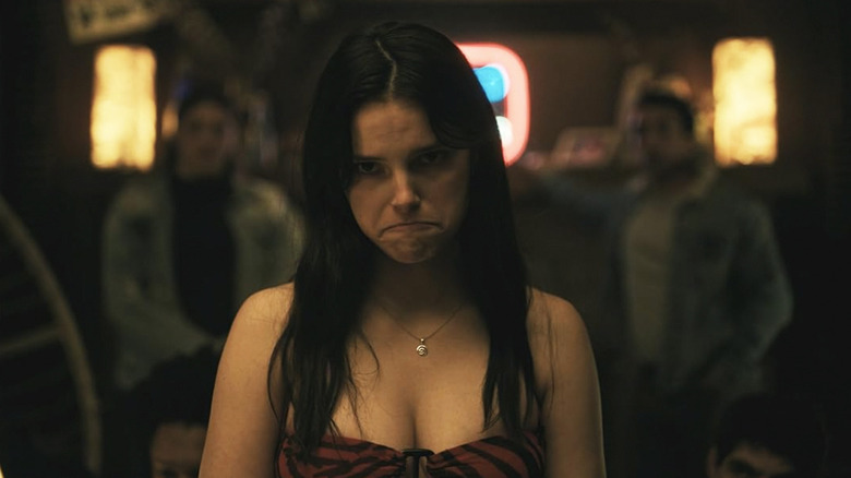 Nikki pouting at a party in Obsession