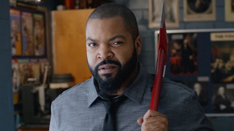 Ice Cube from "Fist Fight" holding an axe.