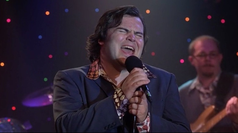 Jack Black as Barry in "High Fidelity" singing on stage