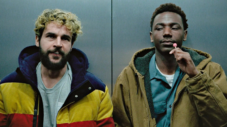 christopher abbott and jerrod carmichael eating lollipops in an elevator in on the count of three