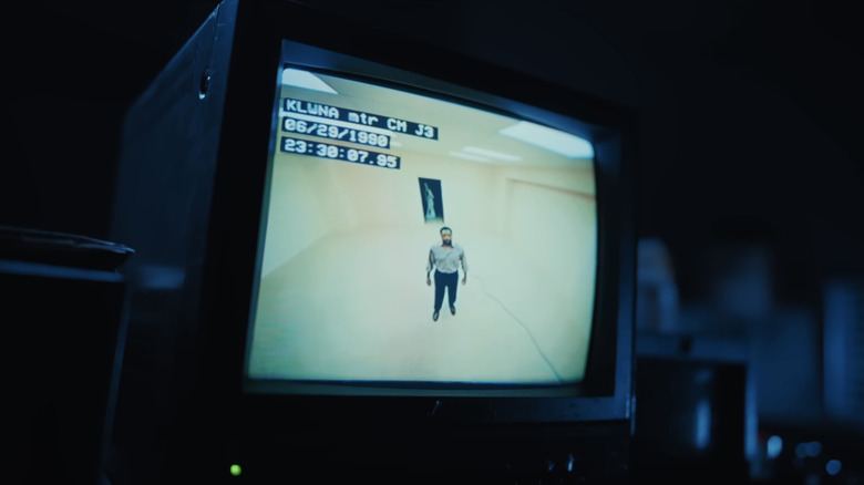 Clark on one of the monitors being watched by Async in Backrooms