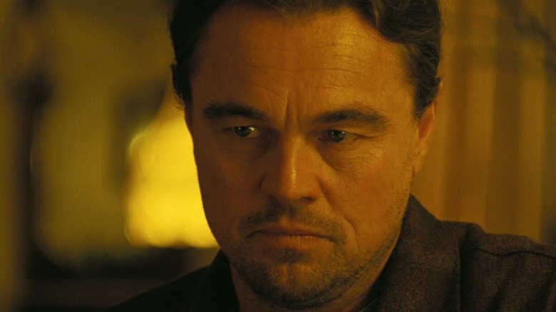 Leonardo DiCaprio as Ben looking serious in One Battle After Another
