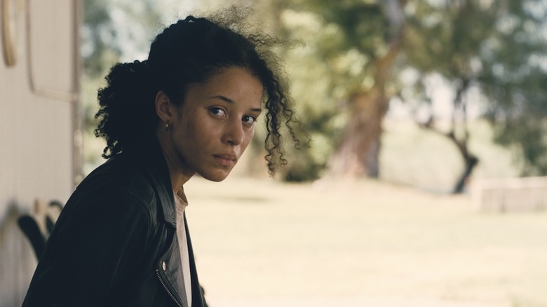 Willa looking to the side scared in One Battle After Another