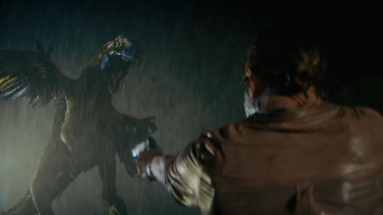 A feathered raptor leaping through the air getting ready to attack in Primitive War