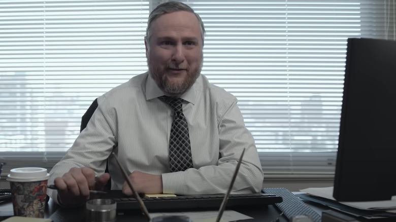 Tim Ki in Ken Davis sat on his office on the paper