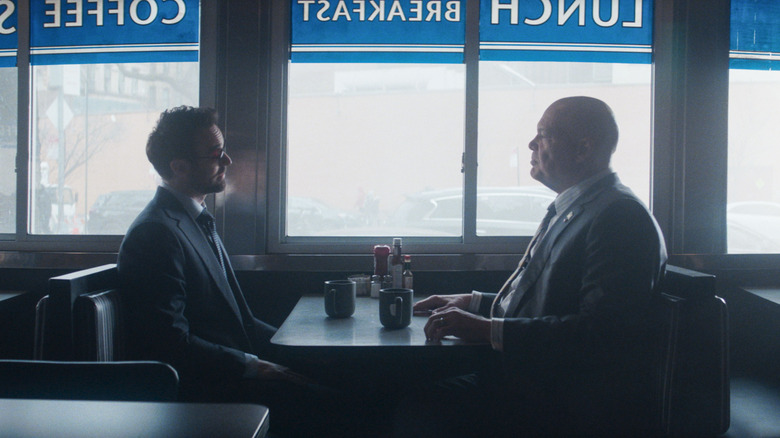 Matt Murdock and Wilson Fisk sitting at a diner table together in Daredevil: Born Again Season 1