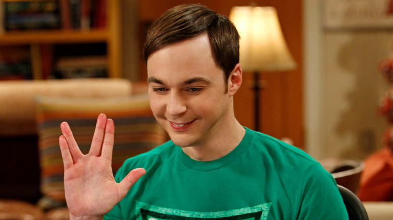 Sheldon doing the Klingon Salute and smiling on The Big Bang Theory