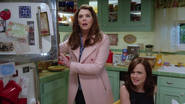 Lorelai digging around in the freezer and Rory making an incredulous face on Gilmore Girls: A Year in the Life