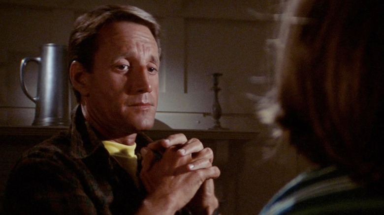 Roy Scheider as Martin Brody shares a tender moment with his son at the dinner table in Jaws