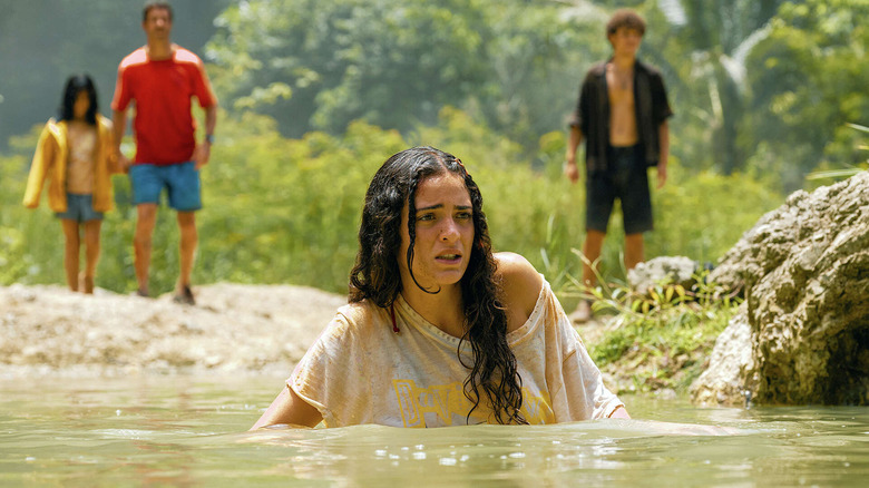 Luna Blaze in the role of Teresa Delgado moves quietly across water in the birth of the global Jurassic