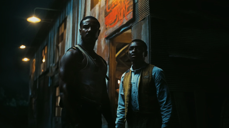 Smoke and Sammie looking in the dark in Sinners