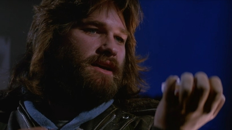 MacReady doing the blood test in John Carpenter's The Thing
