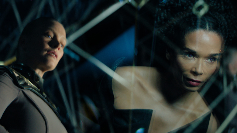 Demerzel and Kalle reflected in a window in Foundation season 3