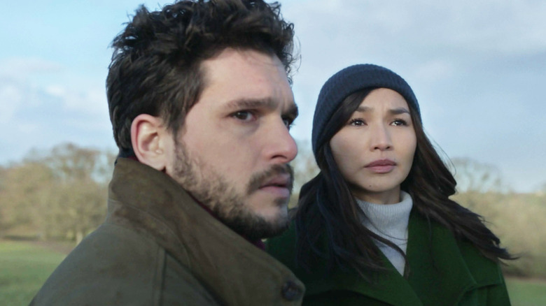 Kit Harington as Dane and Gemma Chan as Sersi looking up at the sky at the end of Eternals