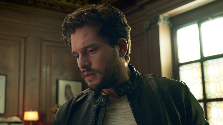 Kit Harington as Dane looking at the Ebony Blade in the Eternals post-credits scene