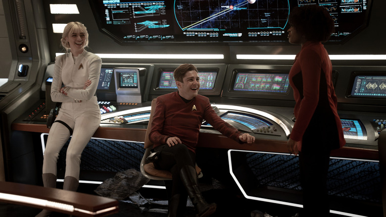 Jess Bush as Chapel, Martin Quinn as Scotty and Celia Rose Gooding as Uhura on the bridge of the Enterprise in season 3 of Star Trek: Strange New Worlds